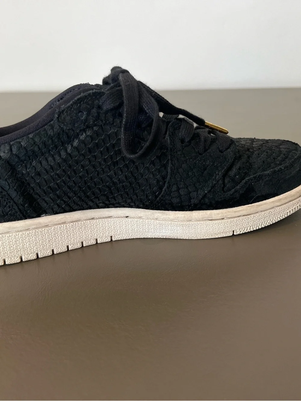 Jordan Women's Black Low-Top Sneakers with Gold Lace Aglets